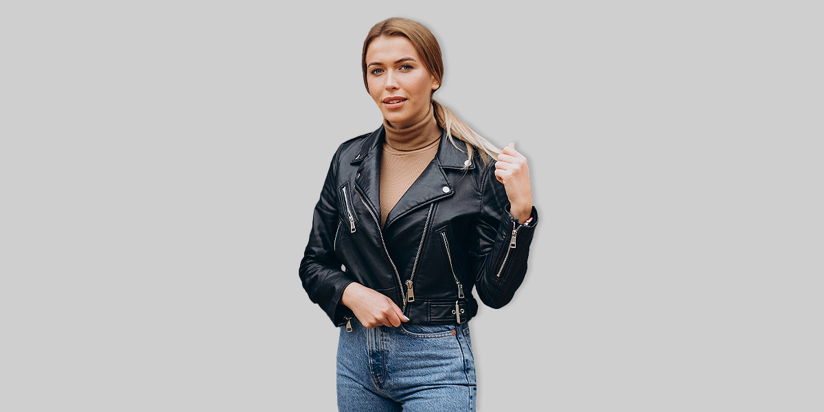 A woman wearing a double rider jacket to show how to wear a leather biker jacket
